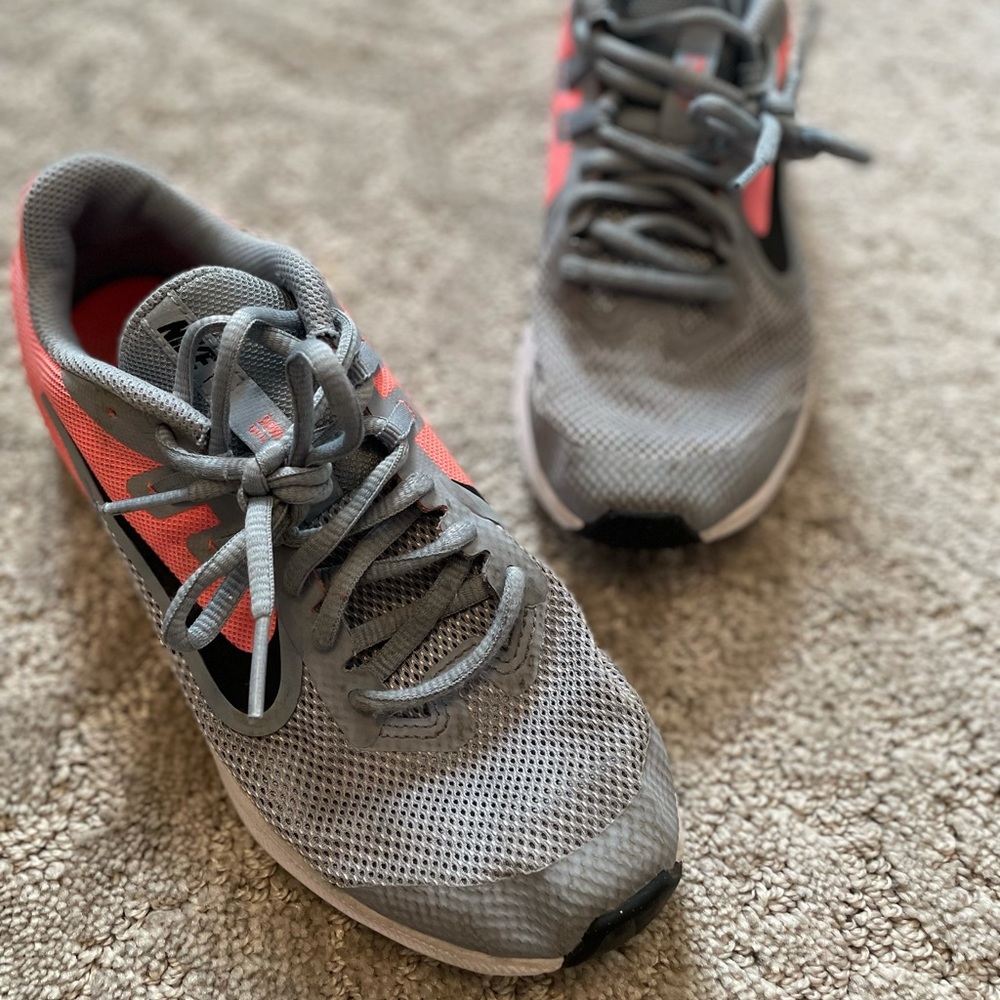 Grey and pink Nike shoes